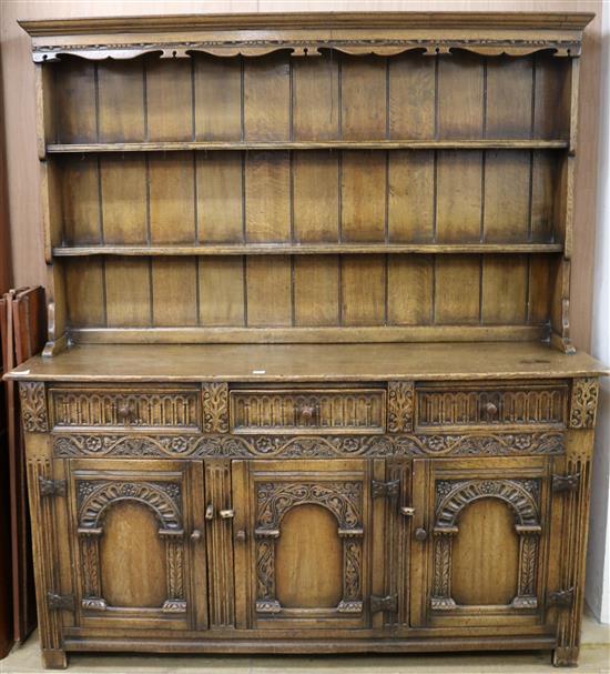 An early 20th century Jacobean style carved oak high back dresser W.169cm